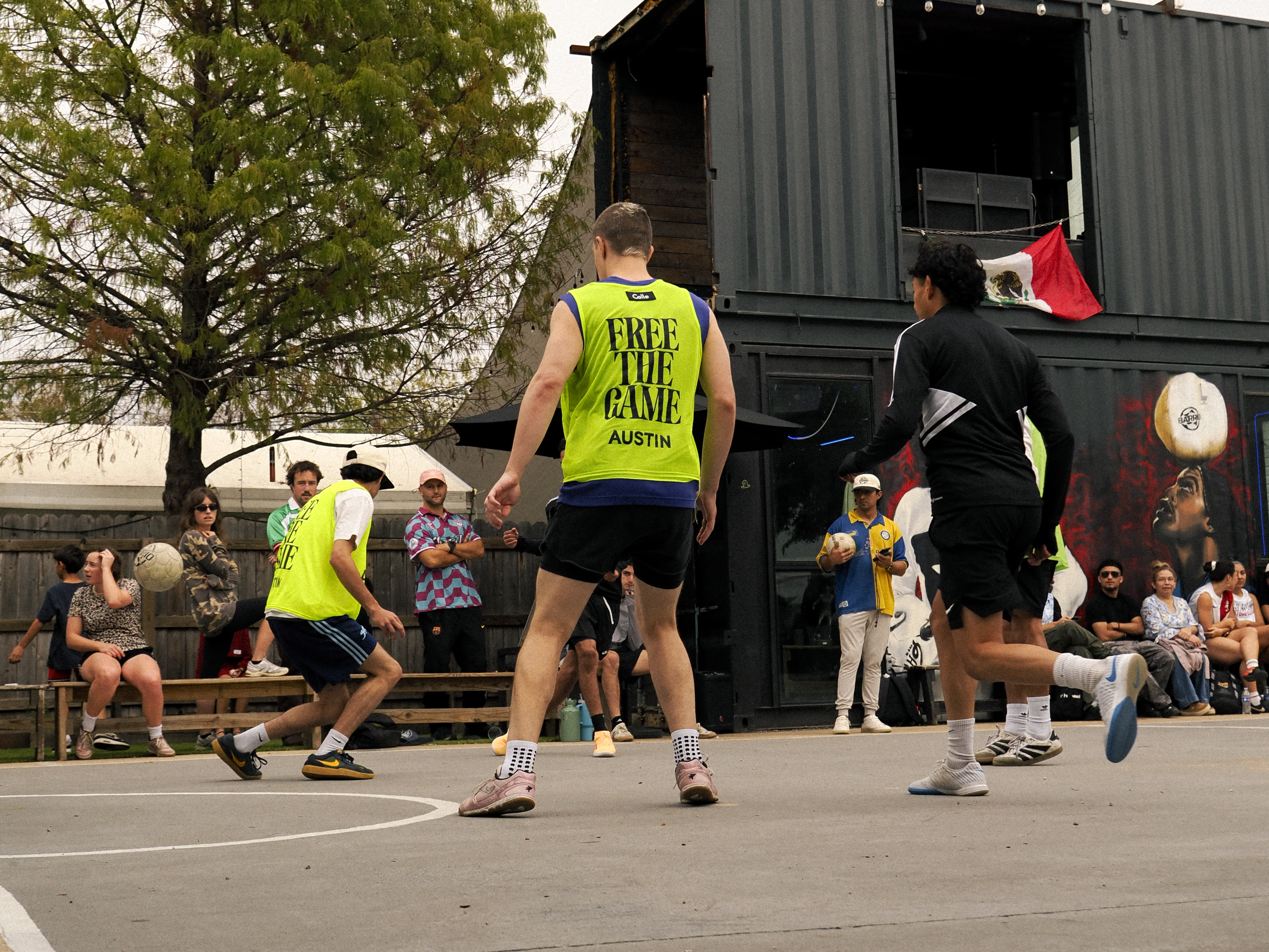 Free the Game match in full swing in front of the container and the crowd
