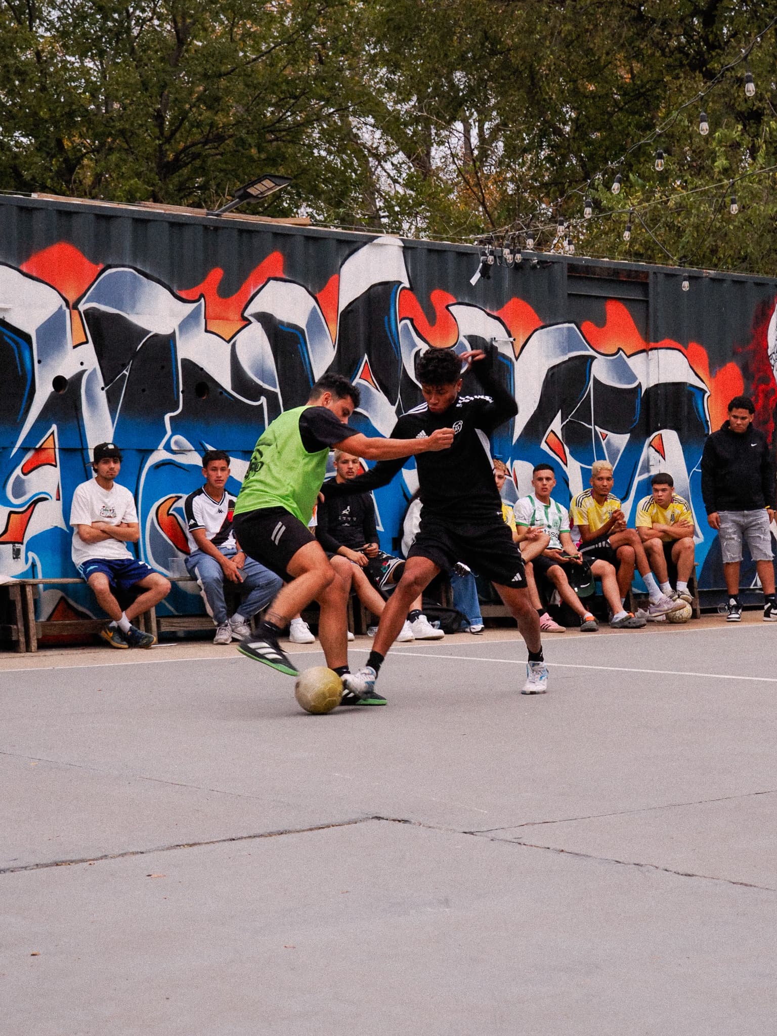 Men's match with graffiti backdrop